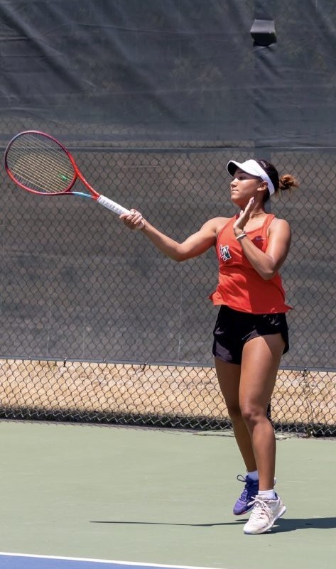 Isabelle May playing tennis